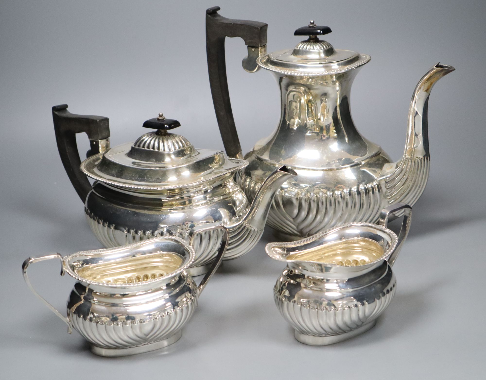 A modern demi fluted silver four piece tea and coffee service, by Viners Ltd, Sheffield, 1963,